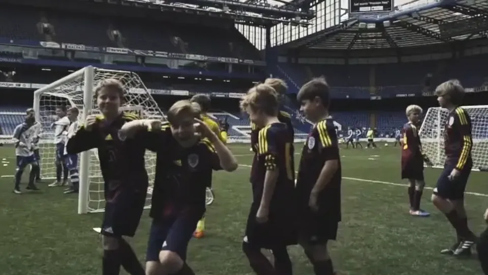 Young players taking part in a Precision Pass tournament at a stadium.