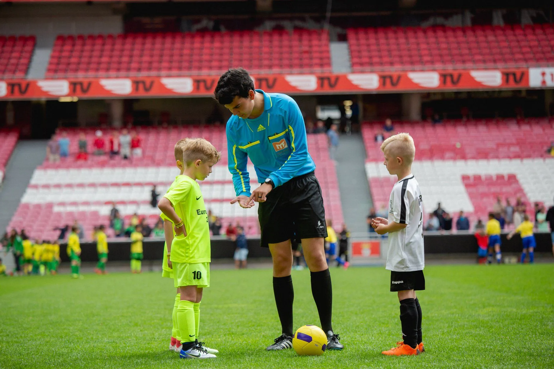 Referee at youth football tournament