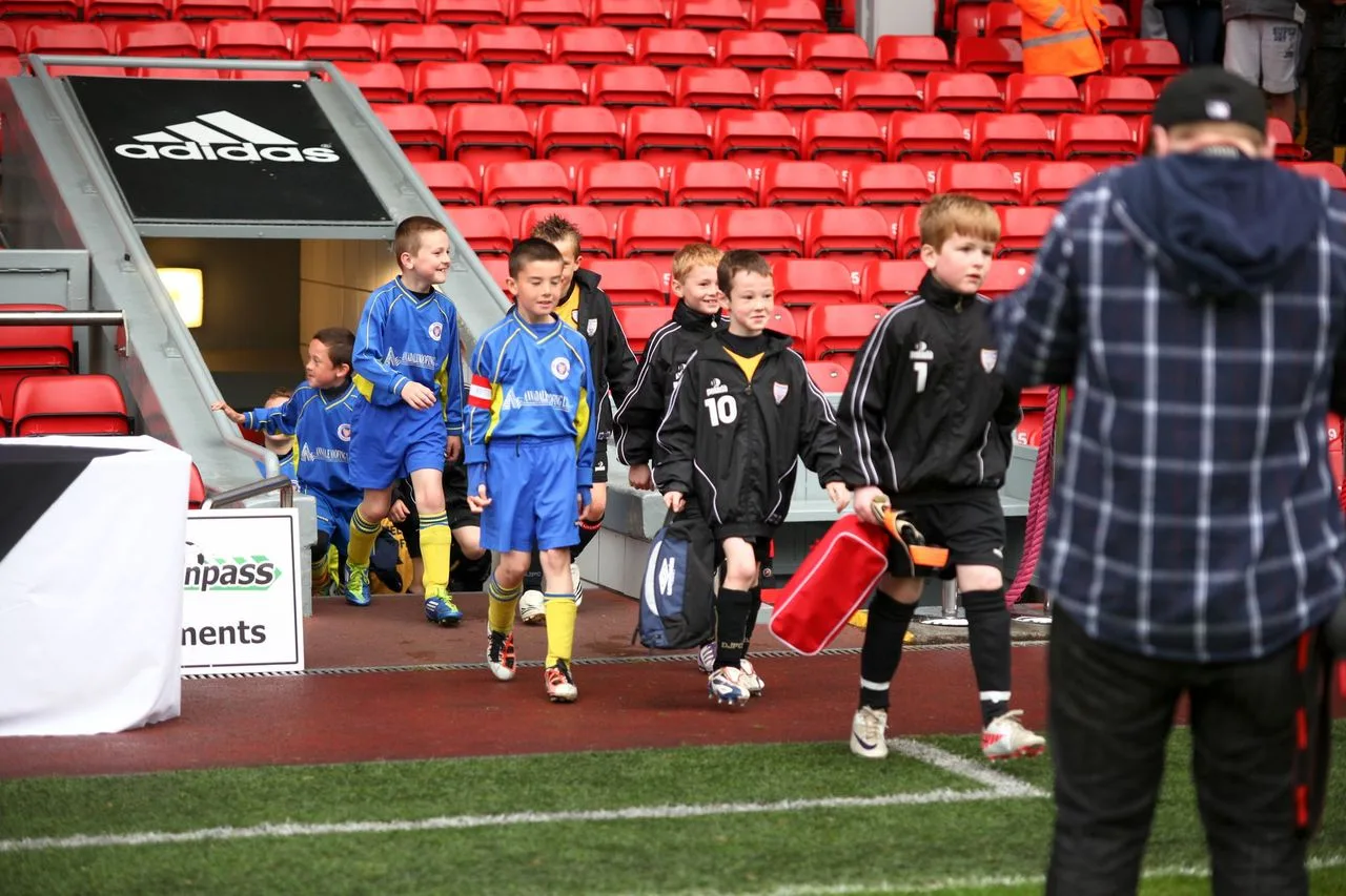 Youth players celebrating at a UK football tournament